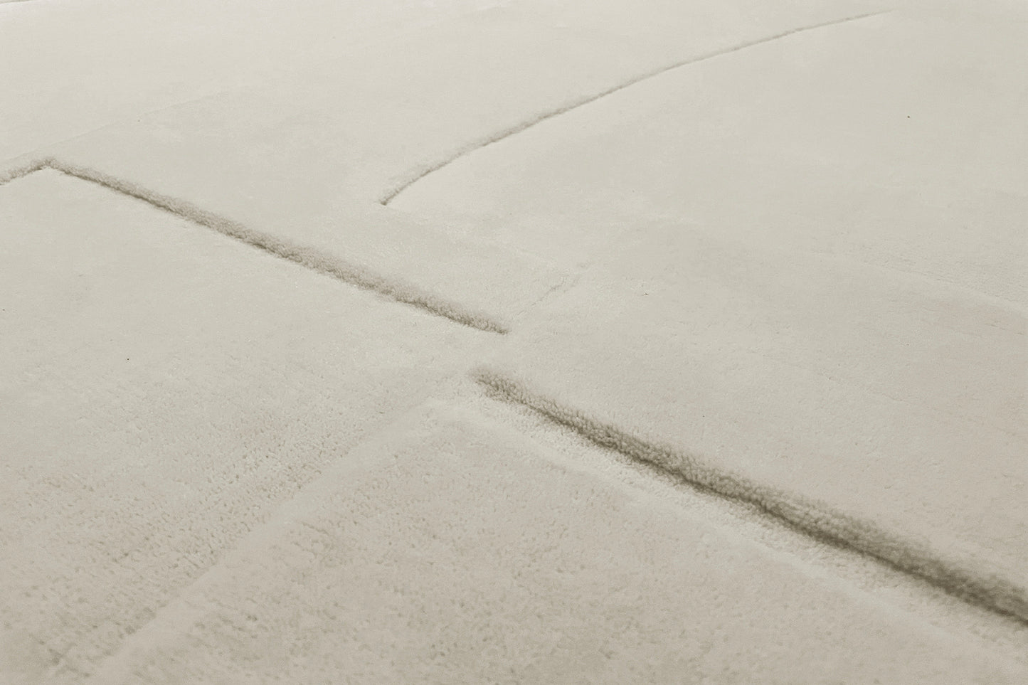 détails tapis tissé main écru