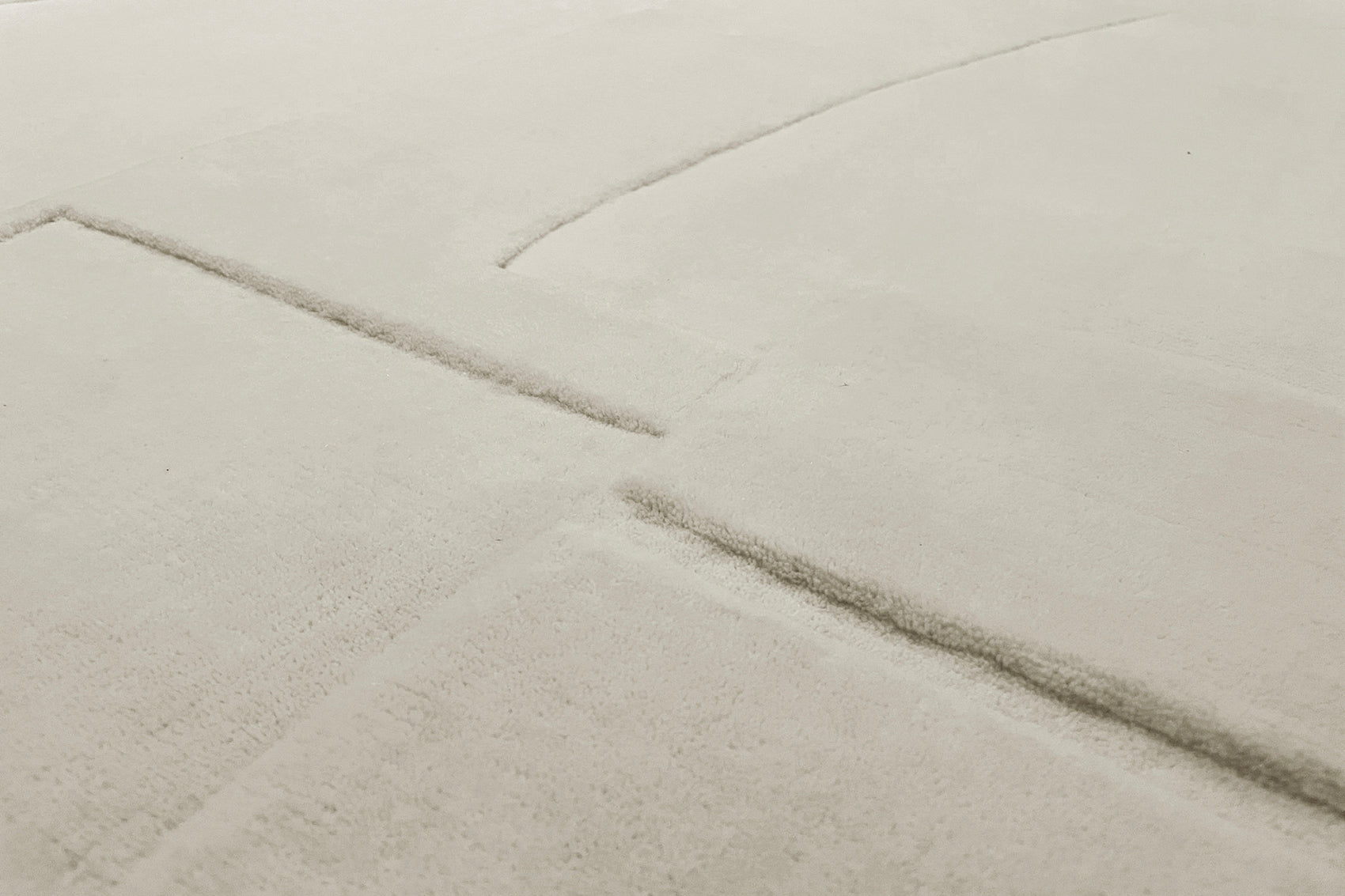 détails tapis tissé main écru