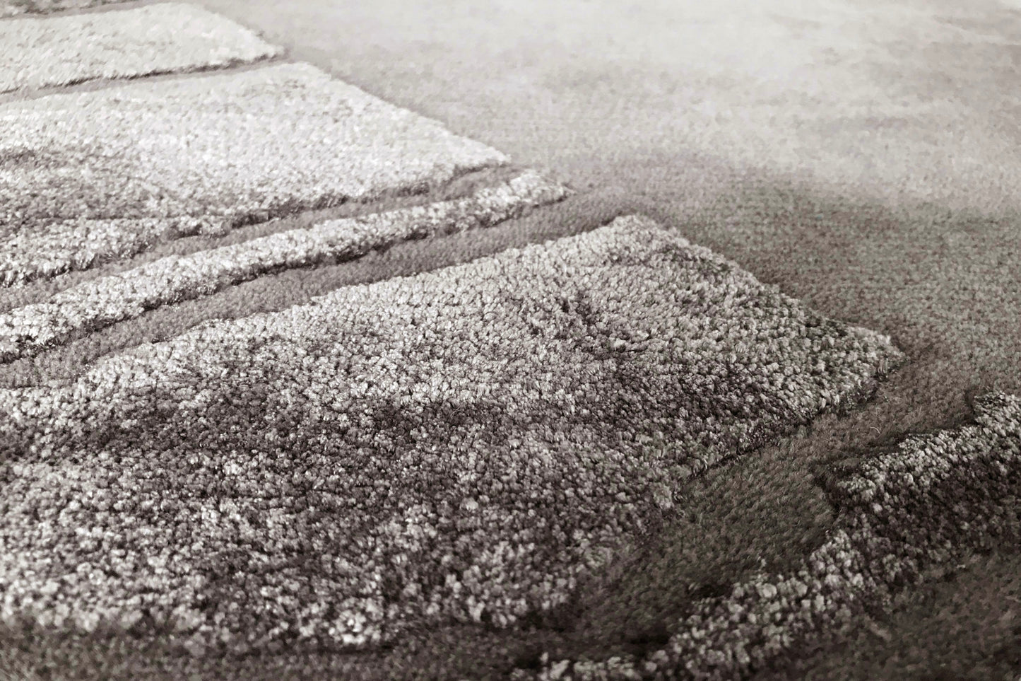 détails tapis noué main gris