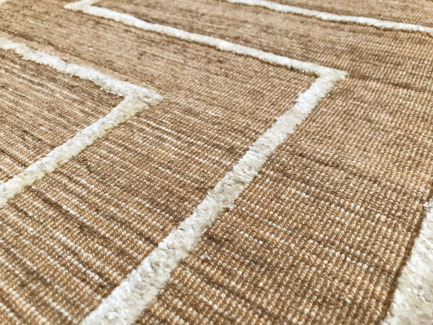 détails tapis tissé main beige écru