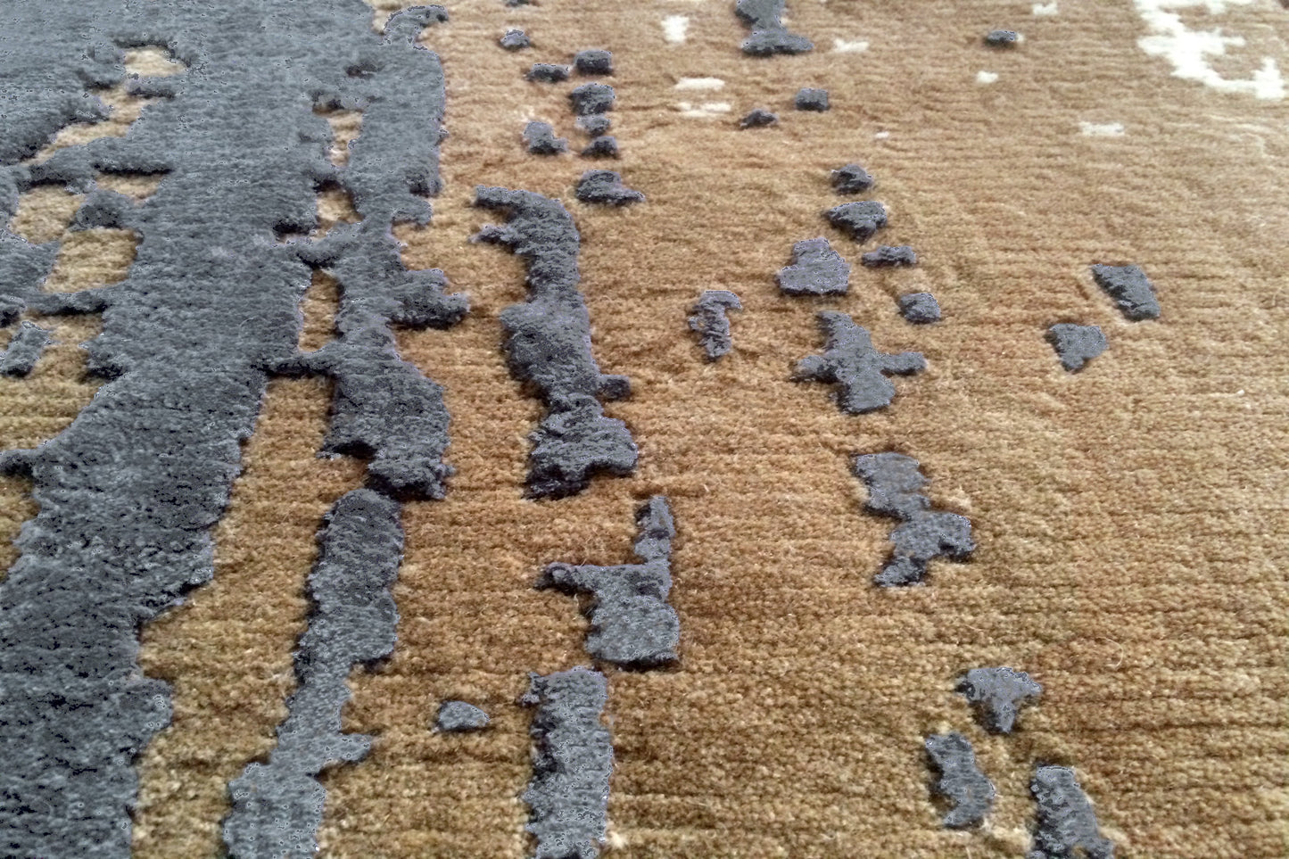 détails tapis noué main beige gris