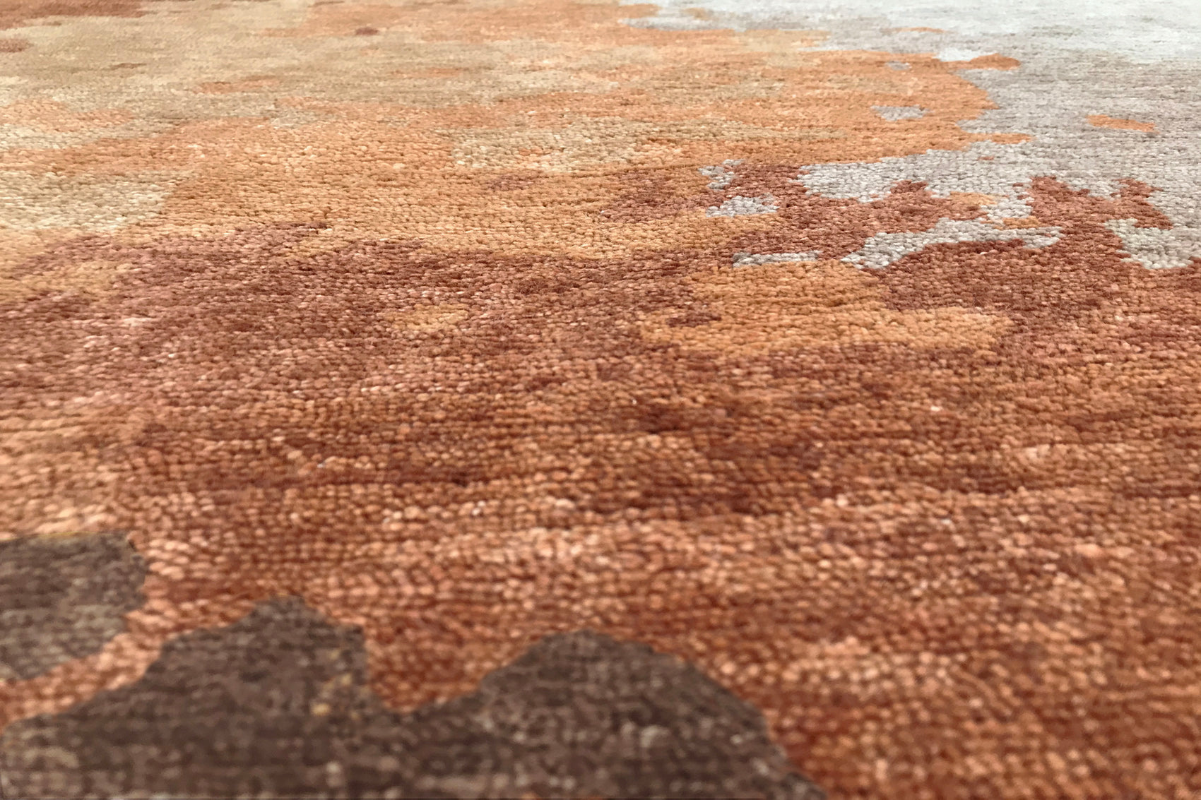 détails tapis noué main orange marron terracotta