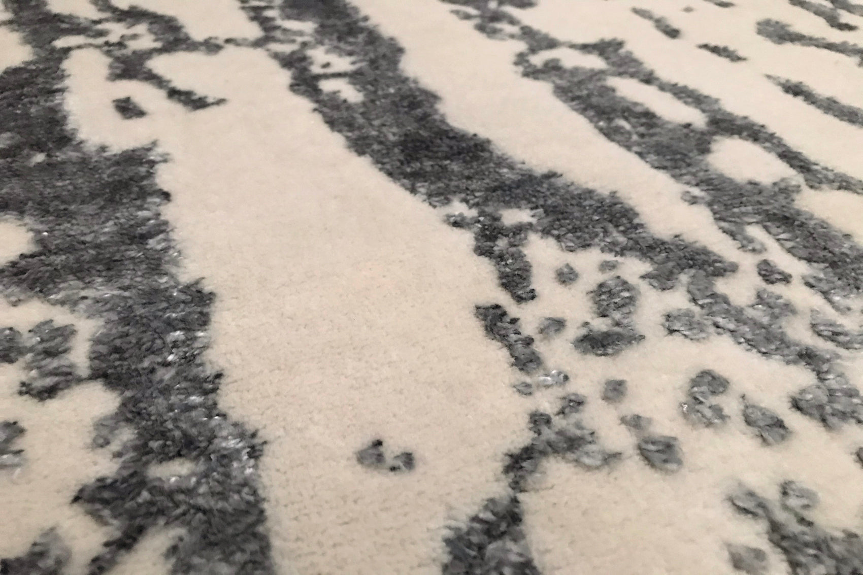détails tapis noué main écru gris