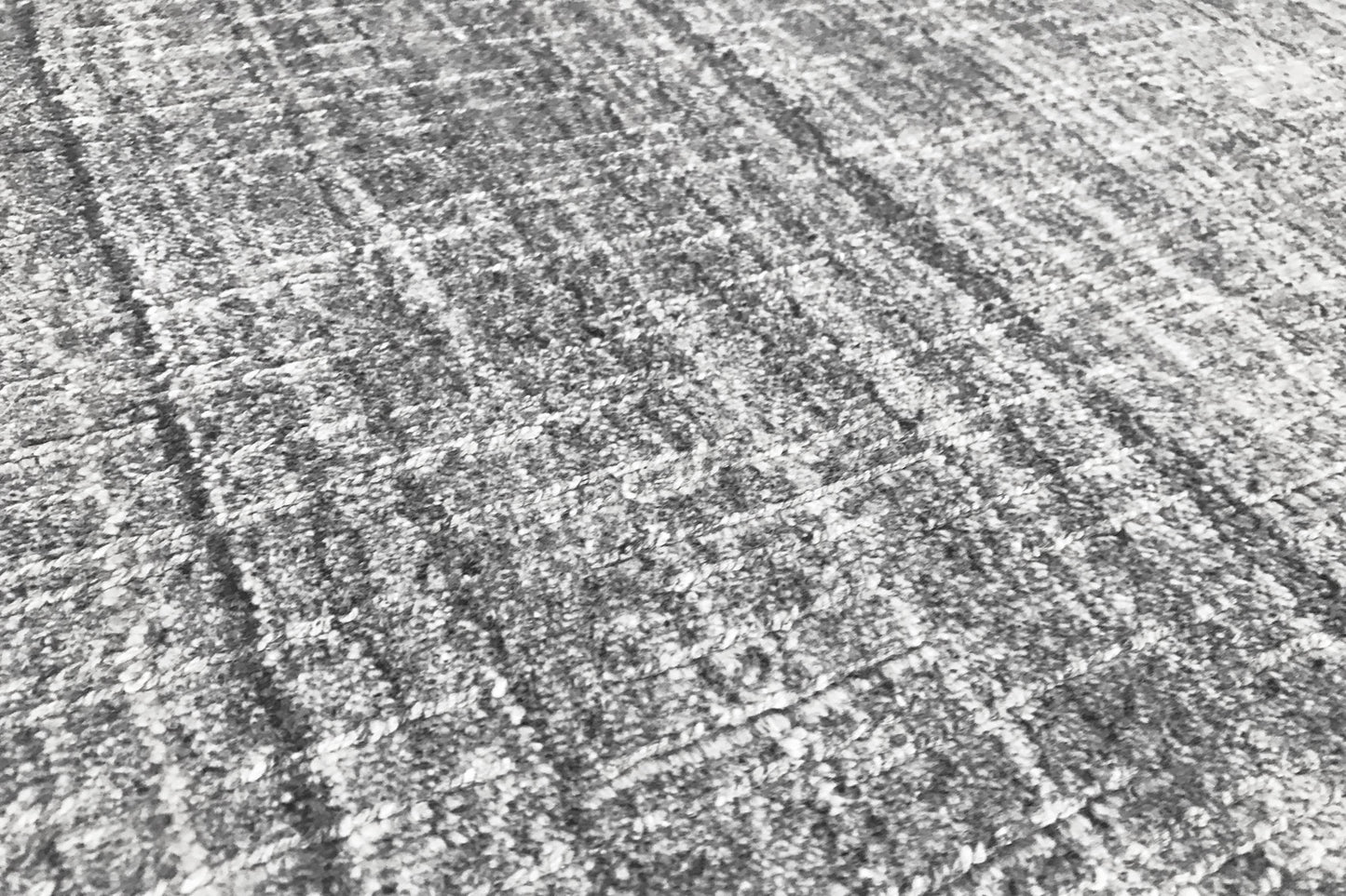 détails tapis tissé main gris